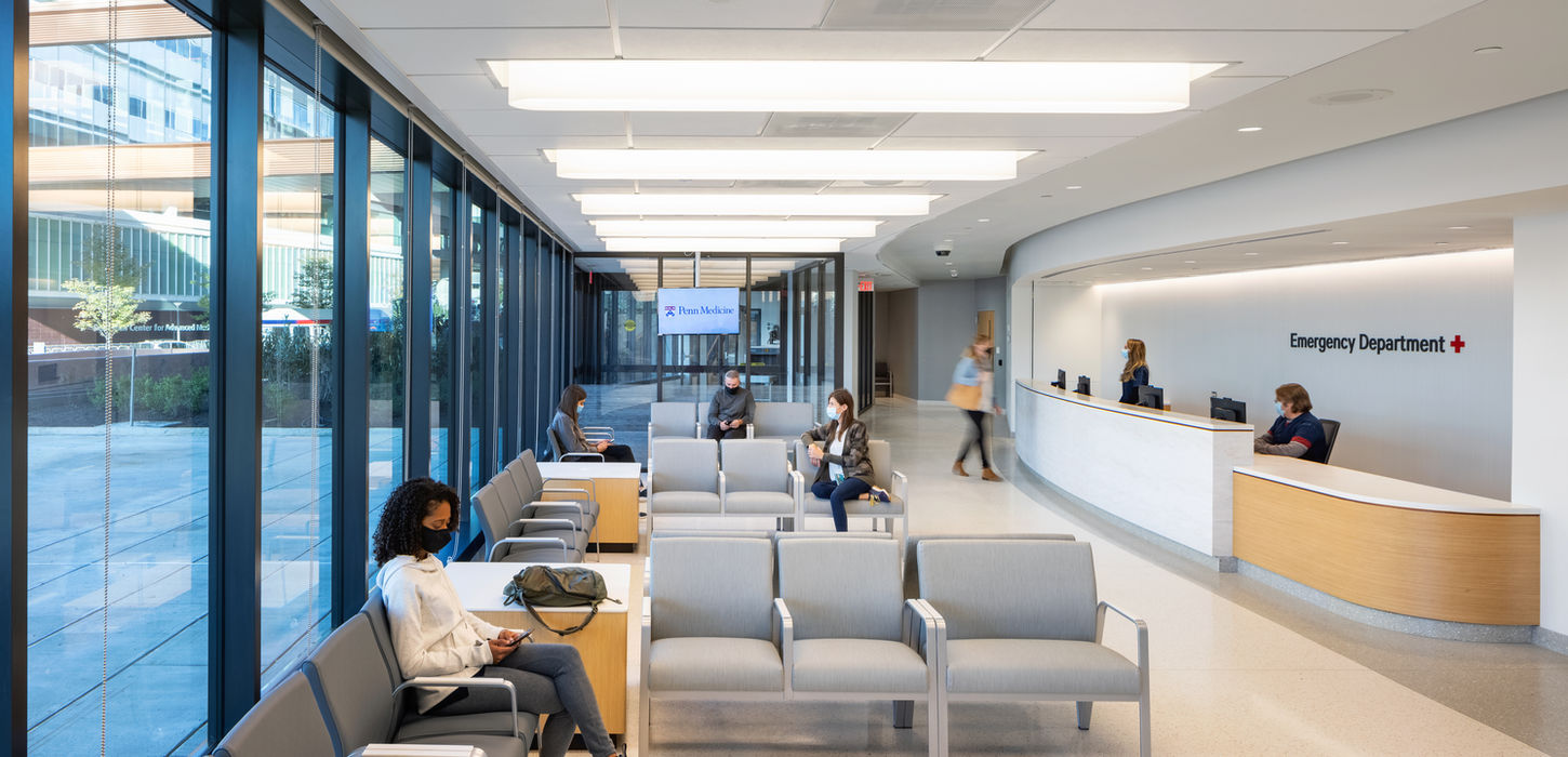 Patients relaxing in a modern hospital waiting area